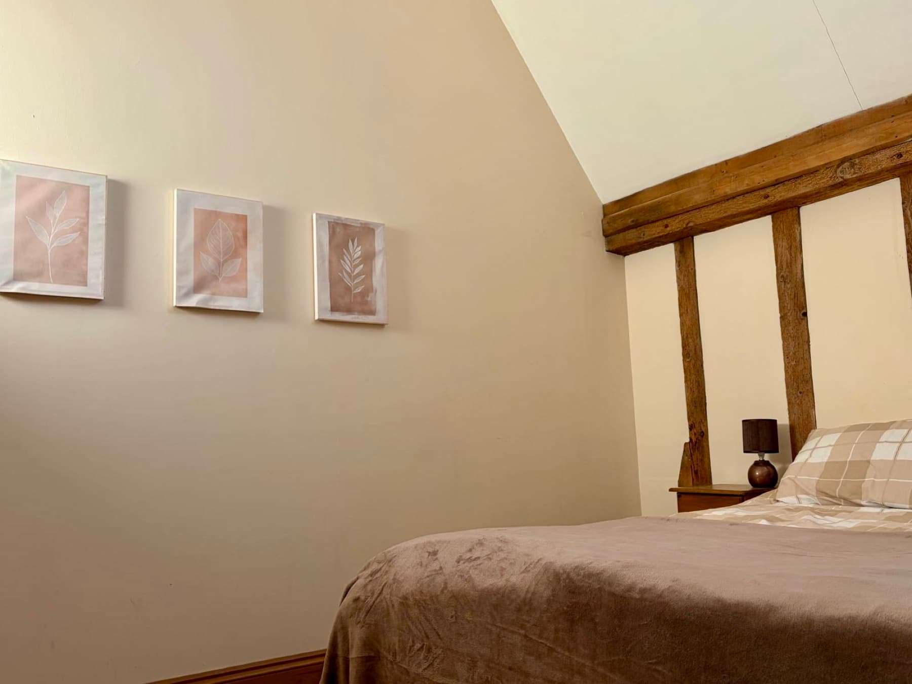 Master bedroom under vaulted ceilings